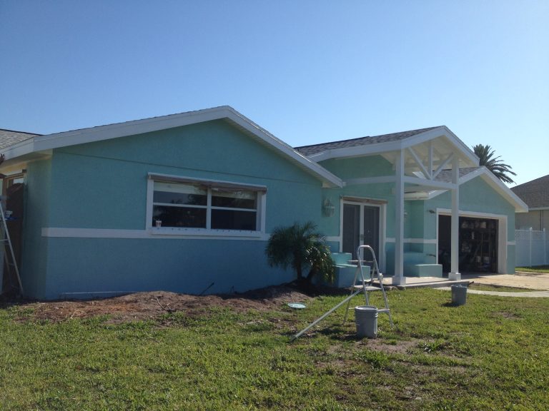 Satellite Beach Residential painting company painted a beautiful 1960s home Bahama water blue
