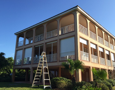 Satellite Beach Commercial Painting Company painting the outside of a condo